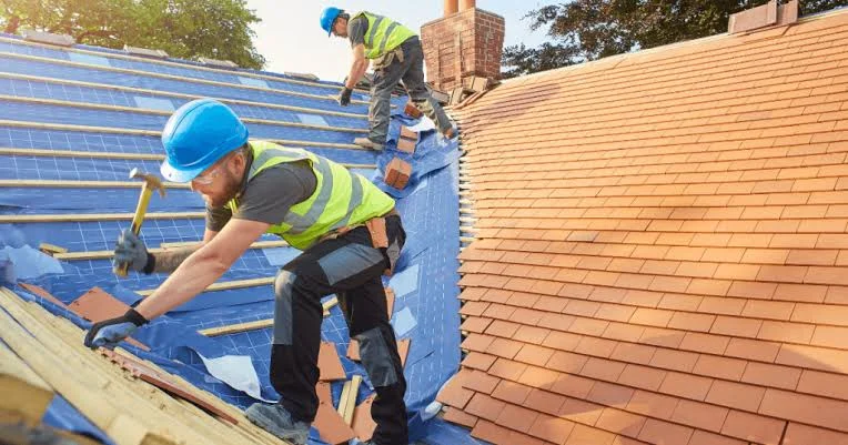 repairing section of the roof affected with damage