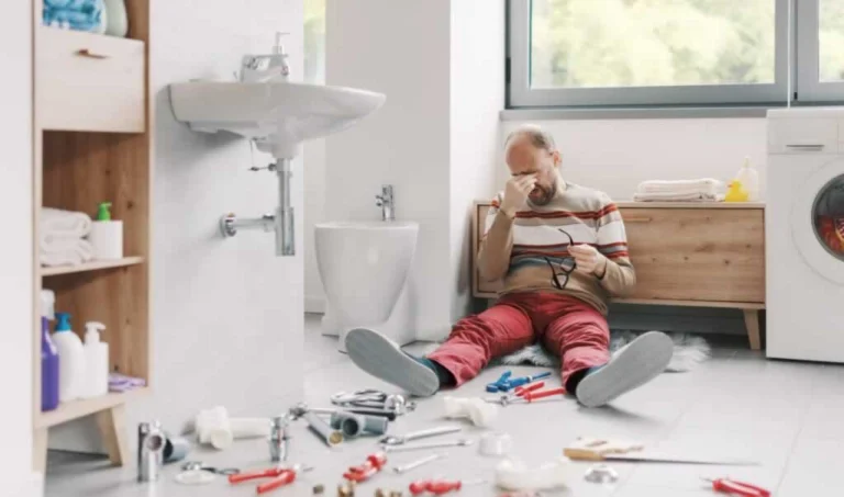 homeowner trying to solve plumbing issues in the bathroom