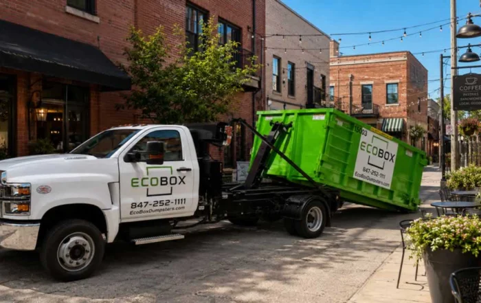 loading dumpster on the truck