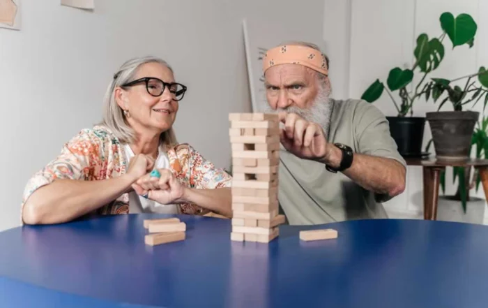 senior couple playing inside the house for seniors