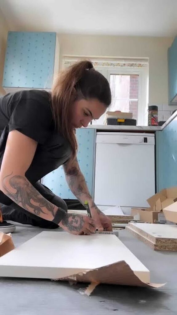 carpenter doing cabinet restoring