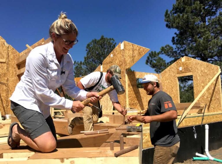 women building home extension