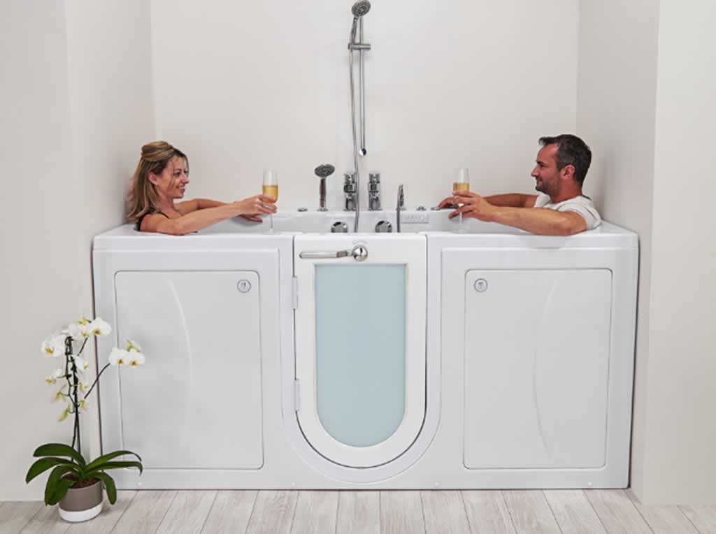 couple enjoying a glass of wine in the walk in bathtub